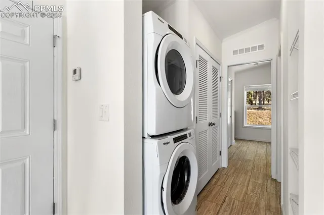 a view of a hallway with washer and dryer