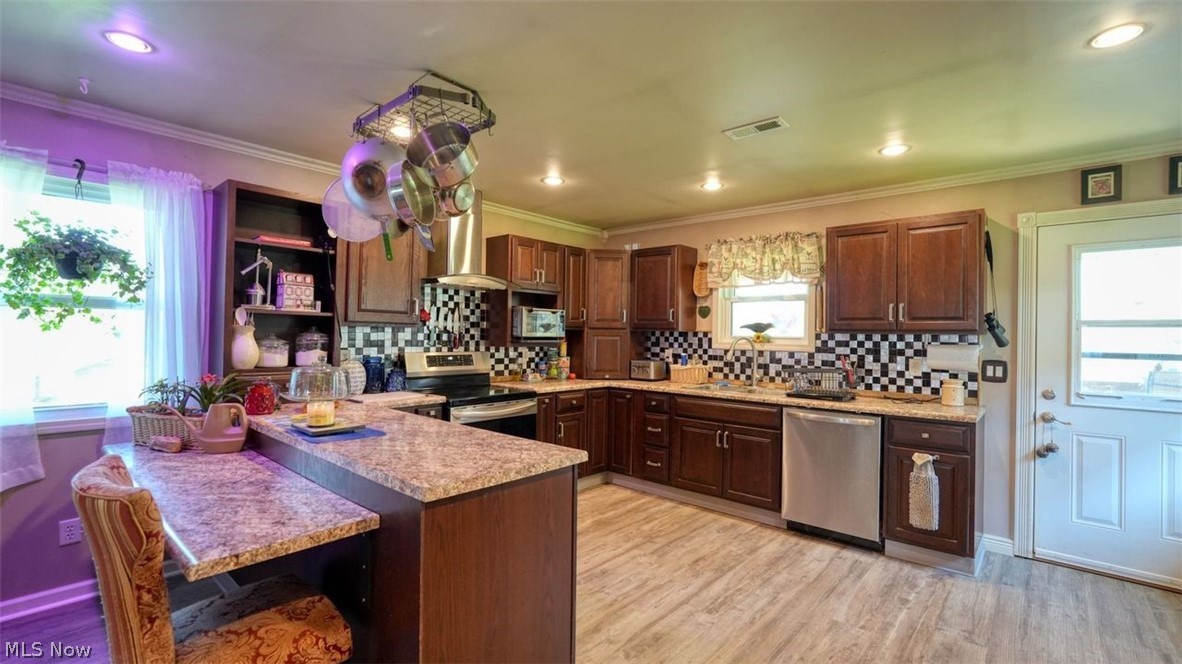 63155 Arrowhead Road Cambridge, OH 43725 - Photo 10 of 50 Kitchen featuring a wealth of natural light and stainless steel appliances