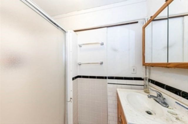 a bathroom with a sink and a shower