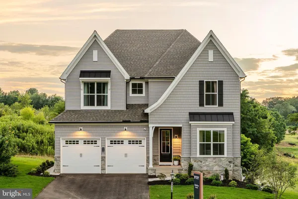 a view of house with yard