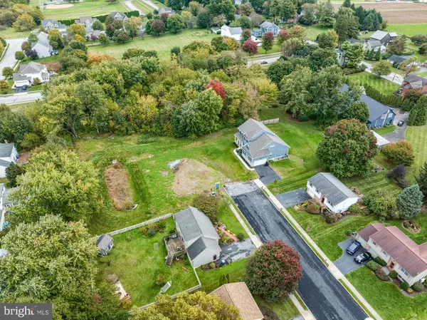 an aerial view of a house with a garden