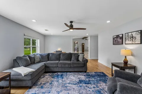 a living room with furniture and a window