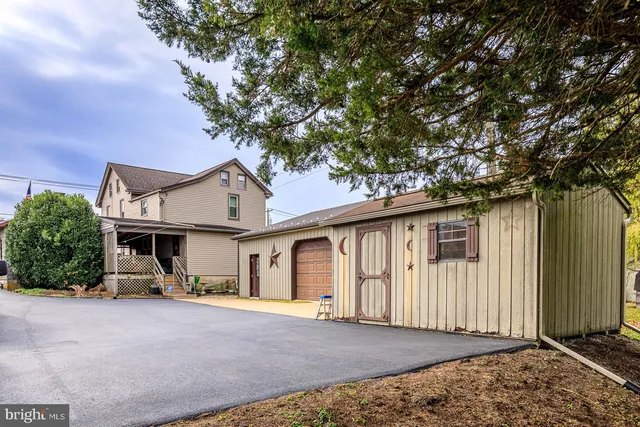 an aerial view of a house with a ocean view