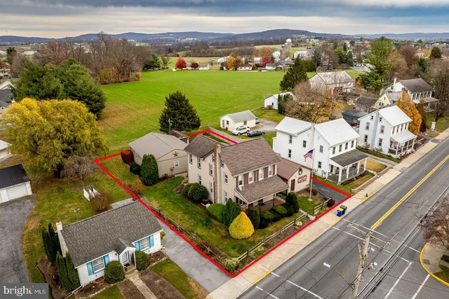a front view of a house with yard and garage