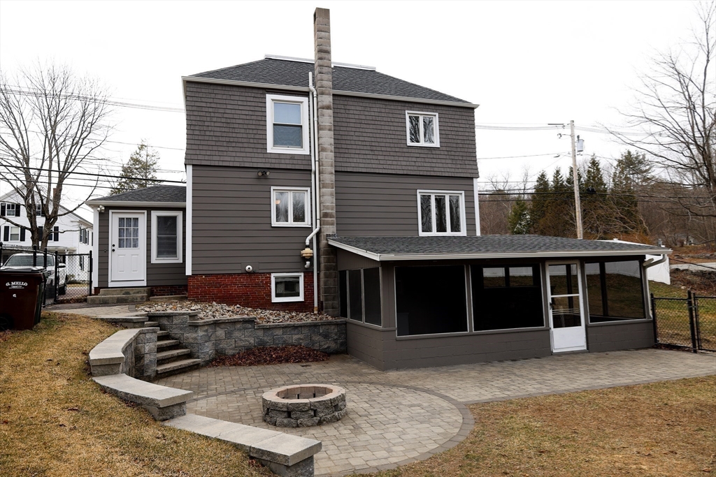 a front view of a house with a yard outdoor seating and garage