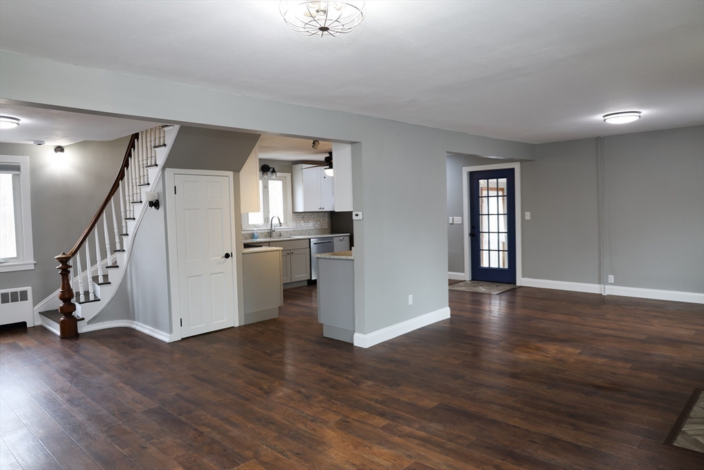 152 Central Street Georgetown, MA 01833 - Photo 12 of 26 a view of a kitchen with wooden floor and electronic appliances