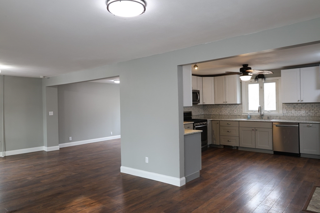 152 Central Street Georgetown, MA 01833 - Photo 13 of 26 a kitchen with a refrigerator and a sink
