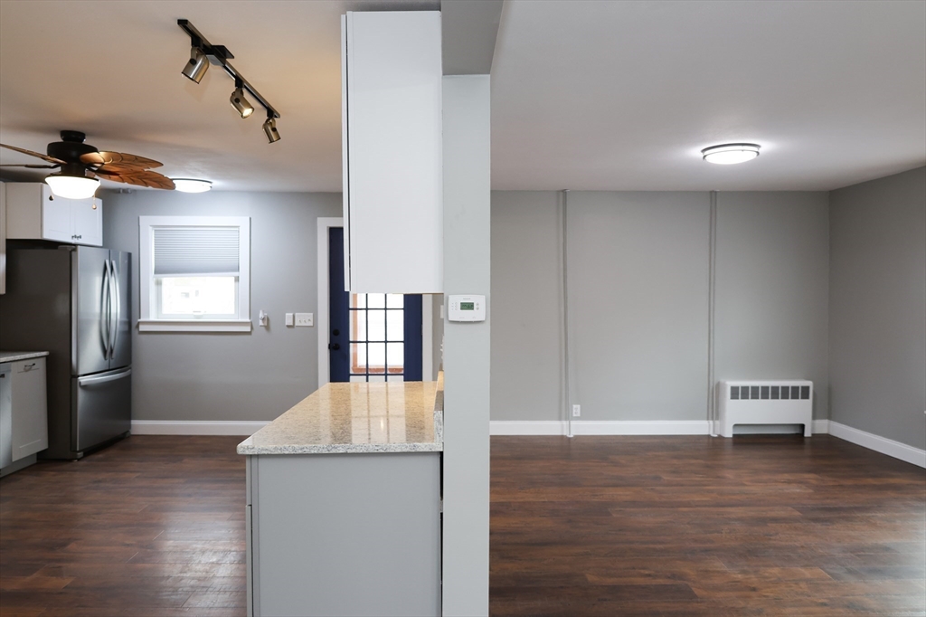 152 Central Street Georgetown, MA 01833 - Photo 14 of 26 a view of a kitchen cabinets and wooden floor