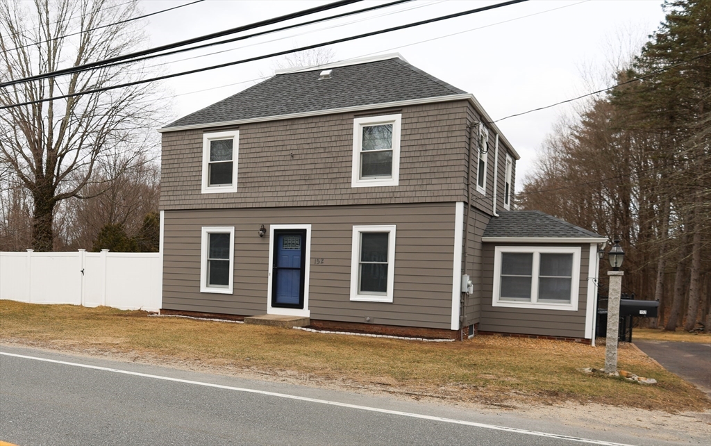 152 Central Street Georgetown, MA 01833 - Photo 2 of 26 a view of a house with a snow in the yard