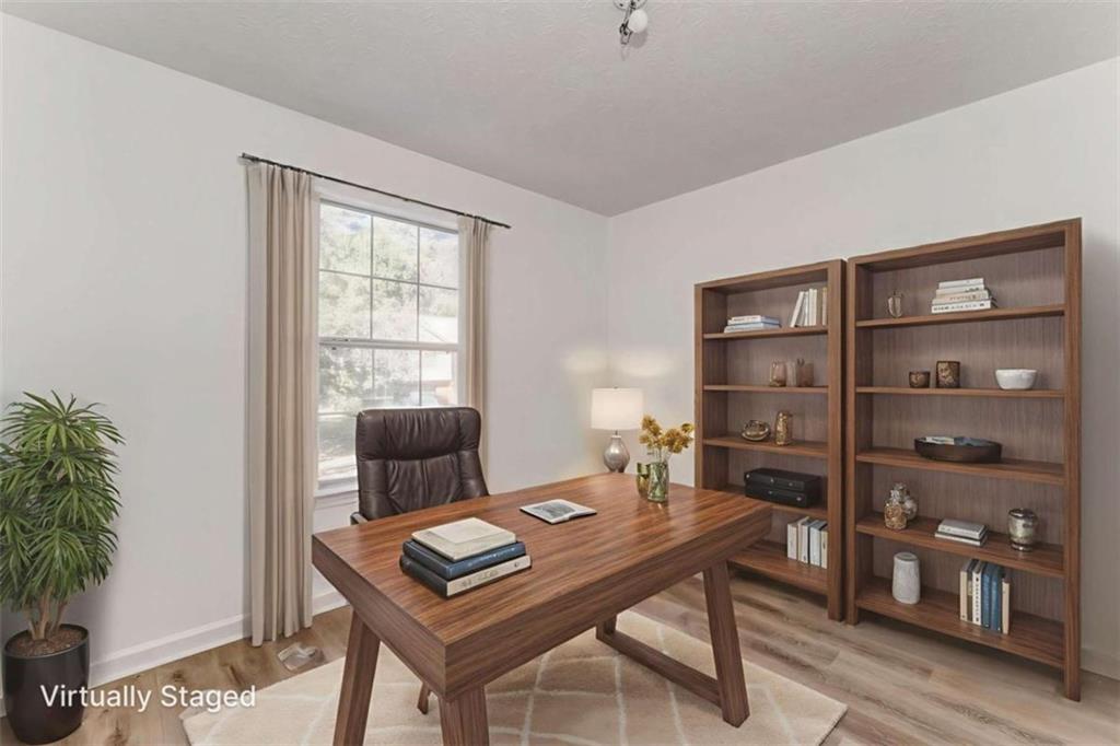 4379 Cross Lane Decatur, GA 30035 - Photo 12 of 19 a view of a workspace with furniture and a potted plant