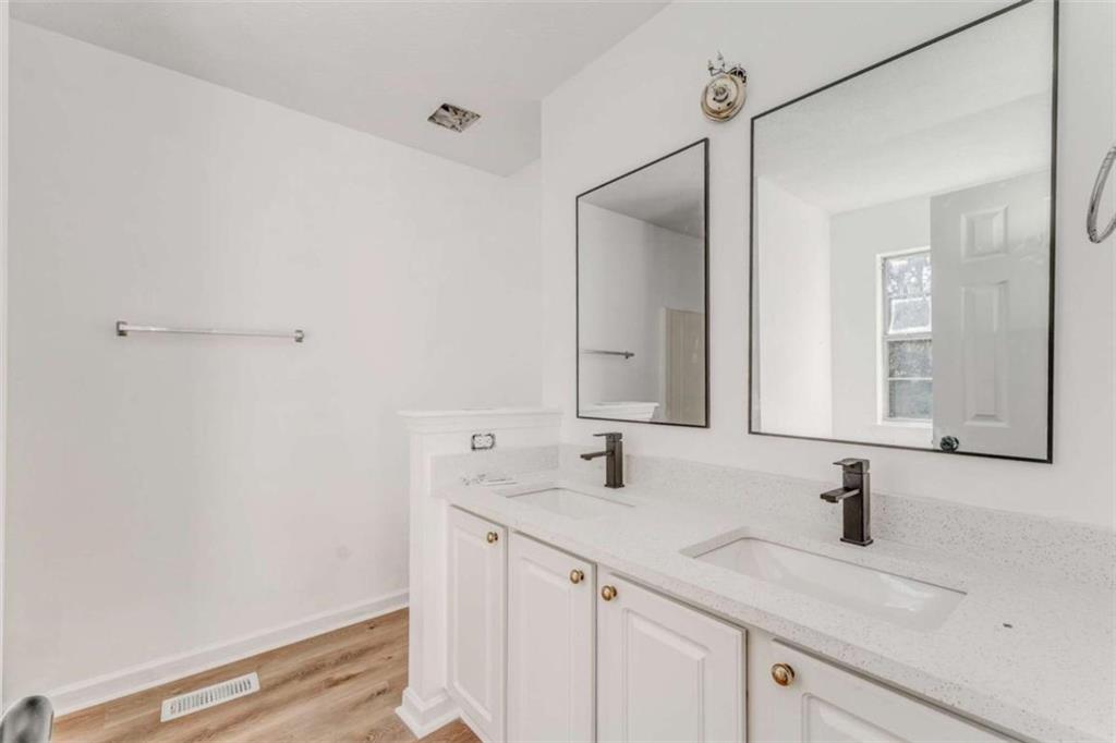 4379 Cross Lane Decatur, GA 30035 - Photo 8 of 19 a bathroom with a sink and a mirror