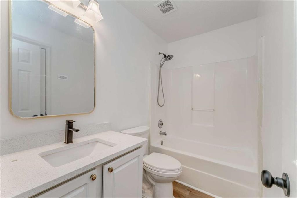 4379 Cross Lane Decatur, GA 30035 - Photo 10 of 19 a bathroom with a sink a toilet and shower