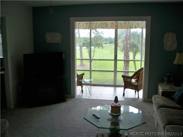 Living Room. Living room has been opened to the glass enclosed tiled balcony