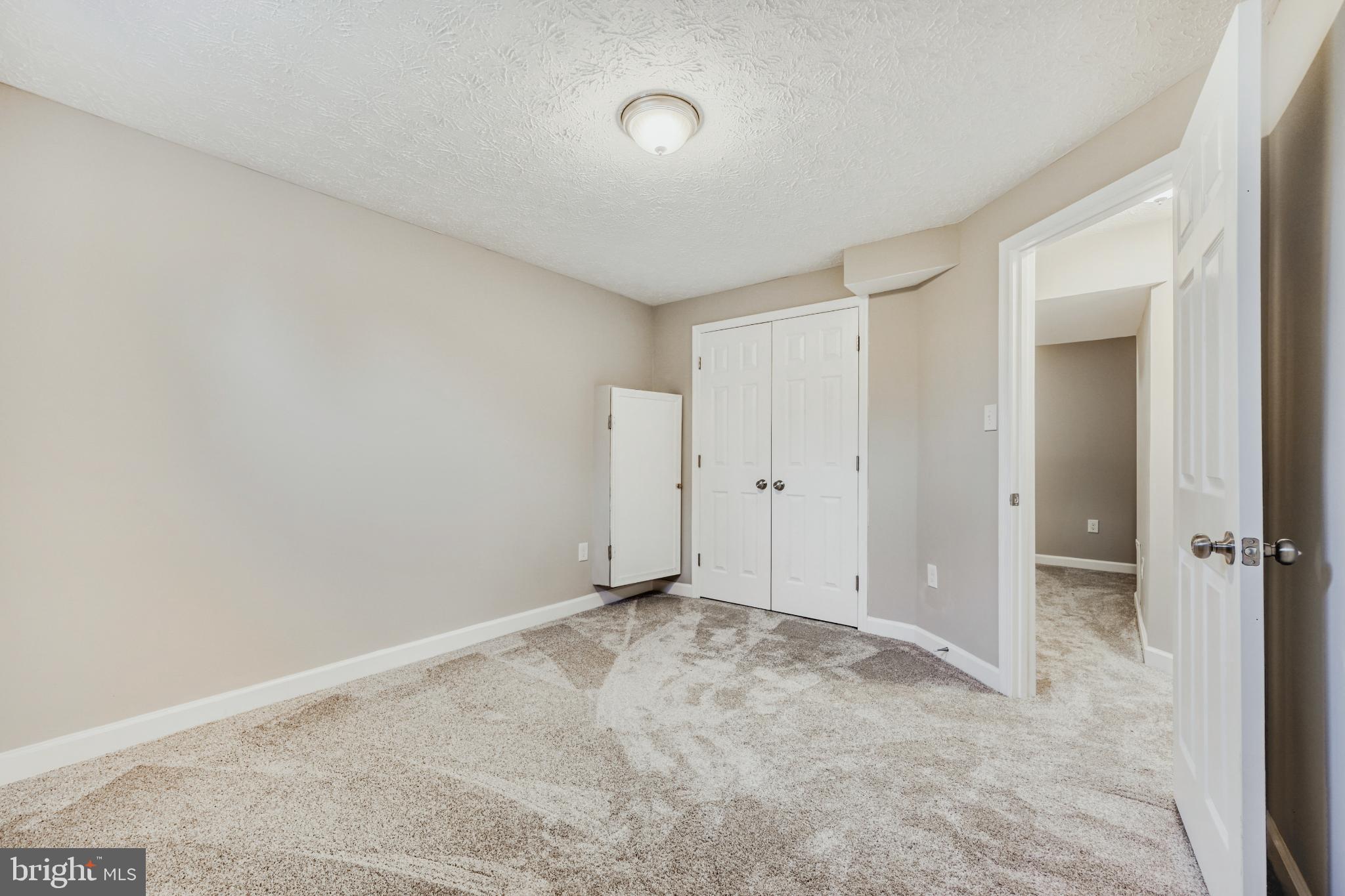 6351 Hanover Crossing Way Hanover, MD 21076 - Photo 11 of 34 Spacious basement bedroom with neutral tones.