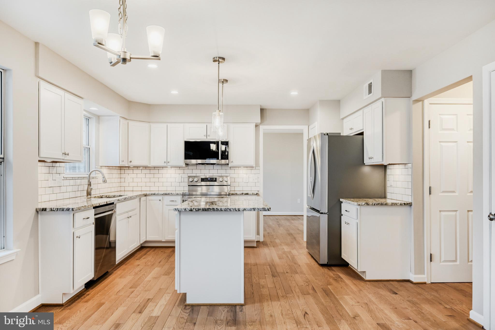 6351 Hanover Crossing Way Hanover, MD 21076 - Photo 13 of 34 Modern kitchen with sleek finishes.