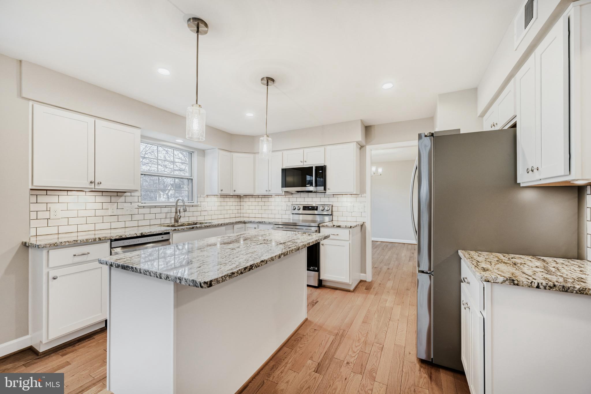 6351 Hanover Crossing Way Hanover, MD 21076 - Photo 15 of 34 Modern kitchen with sleek finishes.