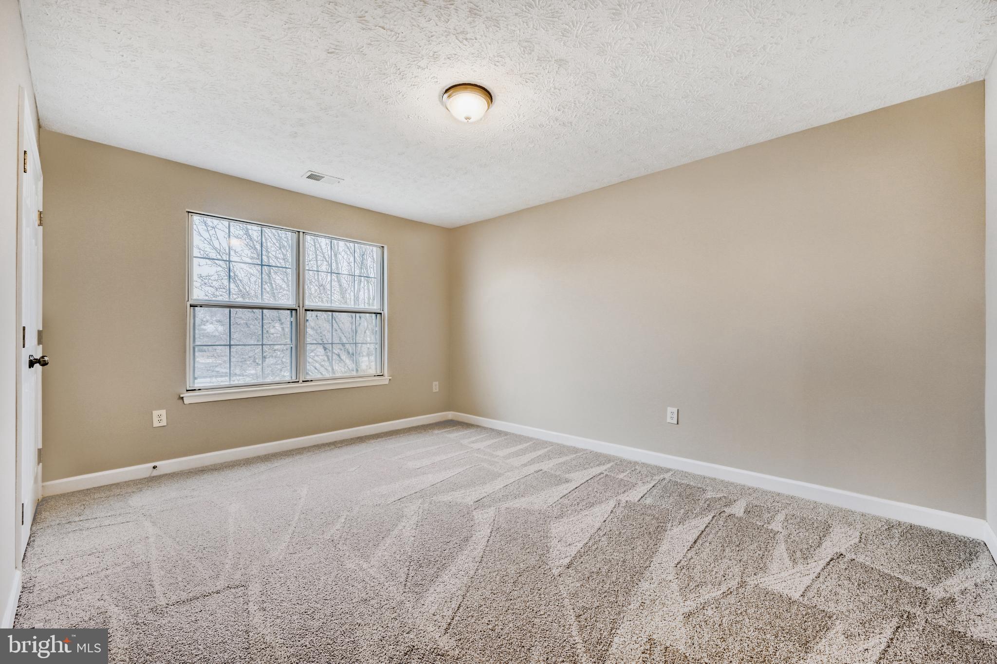6351 Hanover Crossing Way Hanover, MD 21076 - Photo 20 of 34 Spacious bedroom with natural light.