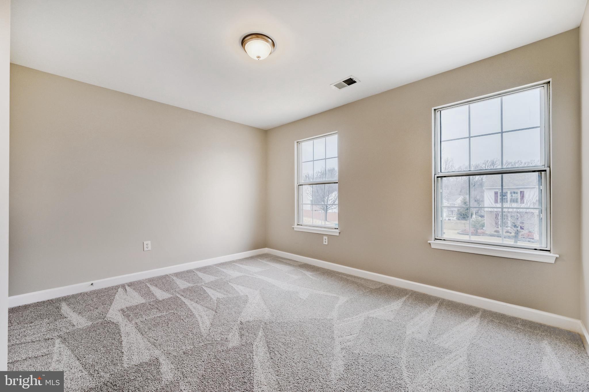 6351 Hanover Crossing Way Hanover, MD 21076 - Photo 21 of 34 Spacious bedroom with natural light.