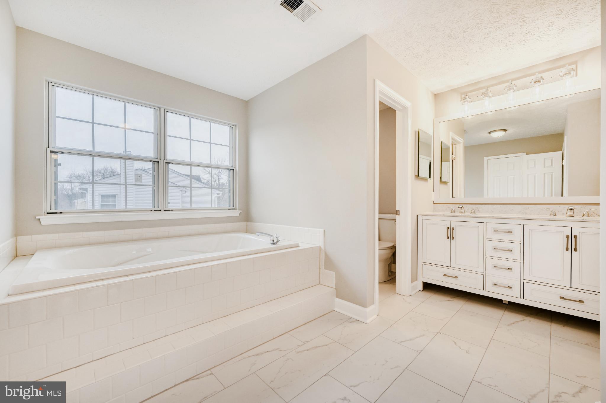6351 Hanover Crossing Way Hanover, MD 21076 - Photo 24 of 34 Serene bathroom with natural light and elegance.