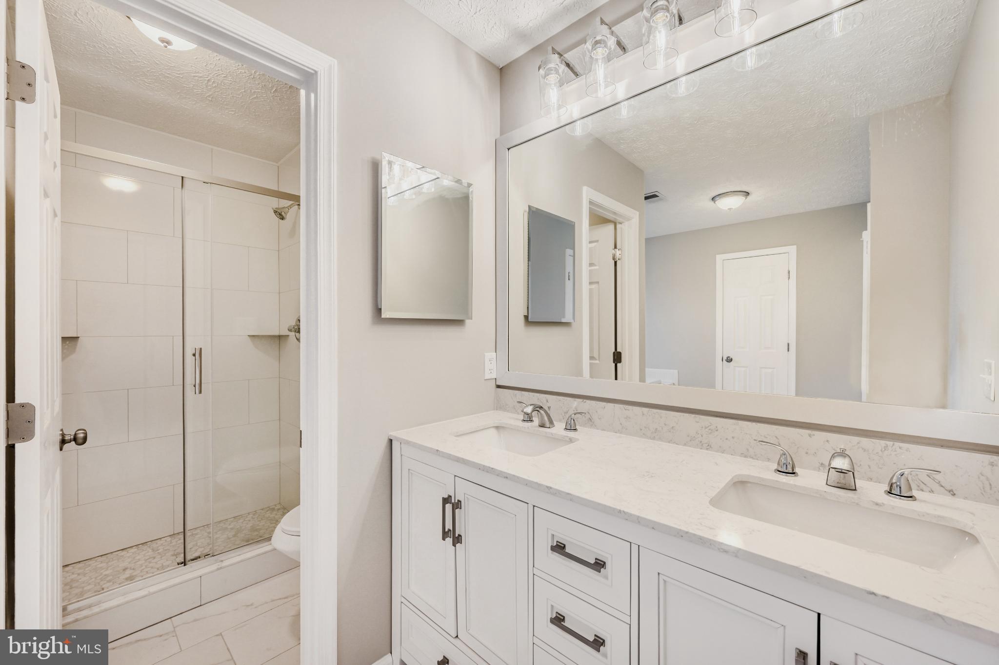 6351 Hanover Crossing Way Hanover, MD 21076 - Photo 25 of 34 Primary bathroom with sleek finishes.