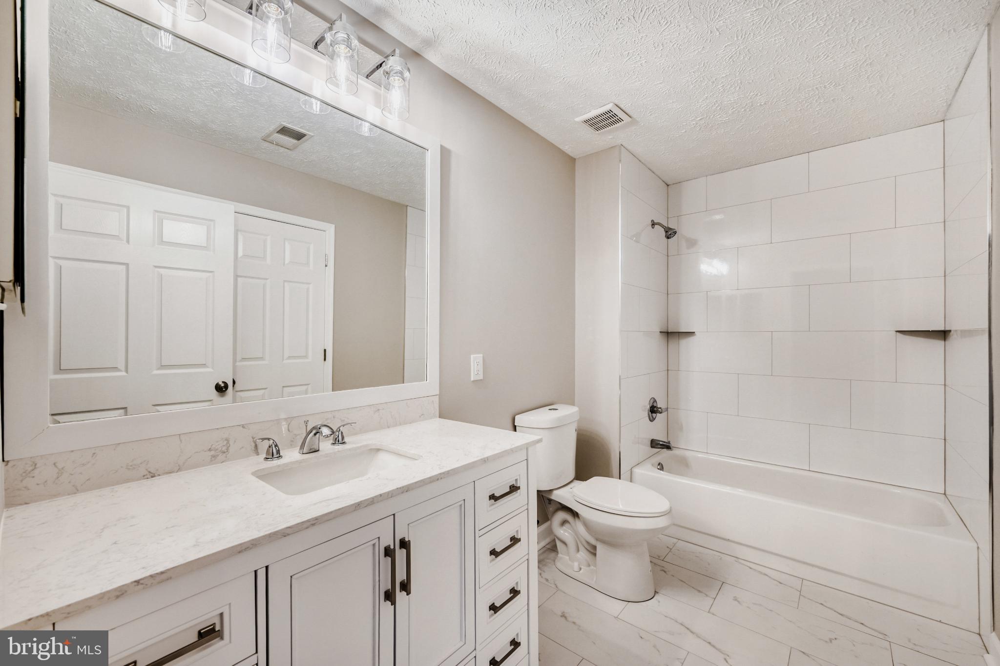 6351 Hanover Crossing Way Hanover, MD 21076 - Photo 26 of 34 Modern hallway bathroom with elegant finishes.