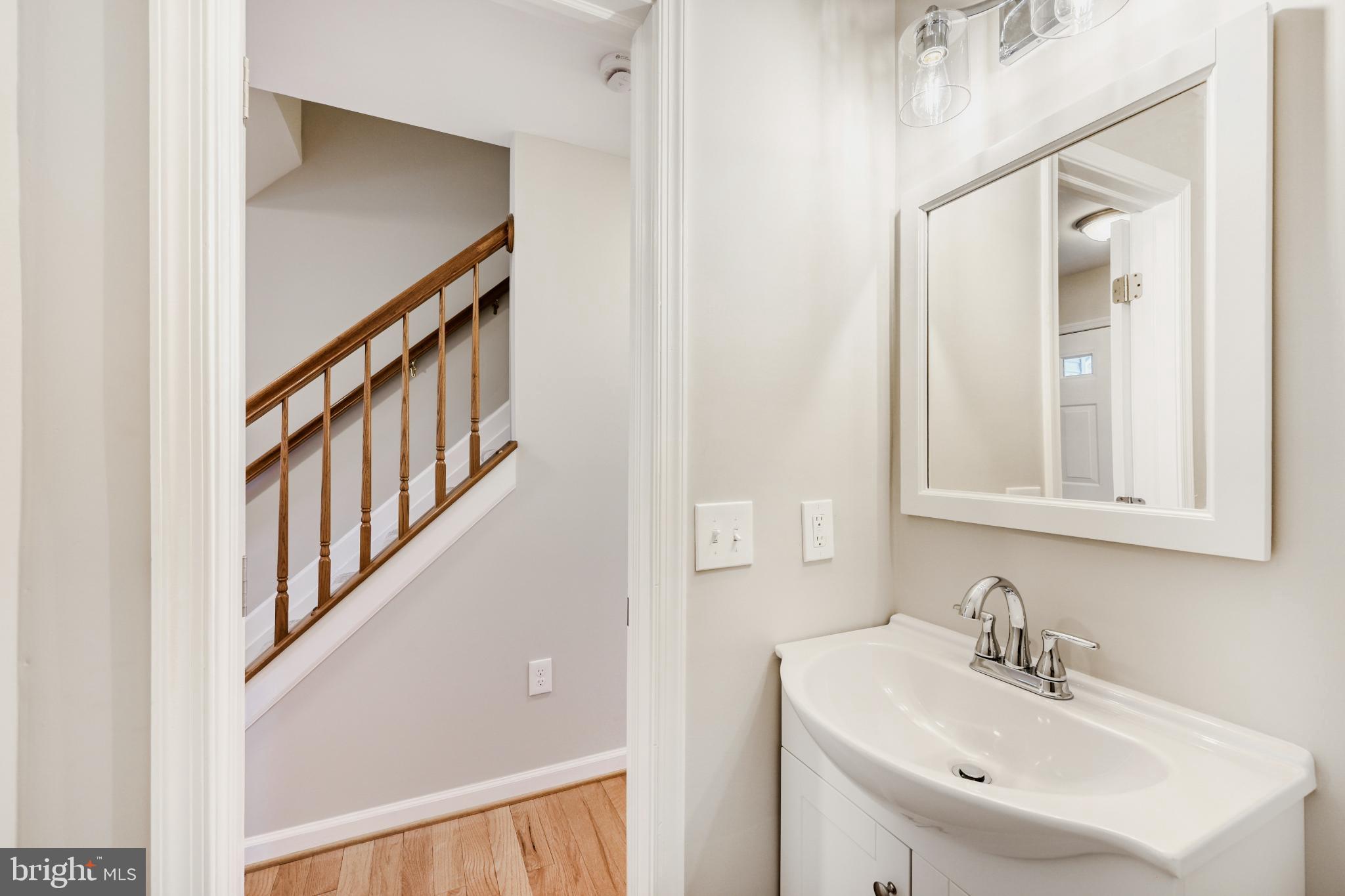 6351 Hanover Crossing Way Hanover, MD 21076 - Photo 27 of 34 Bright and inviting half-bath with elegance.