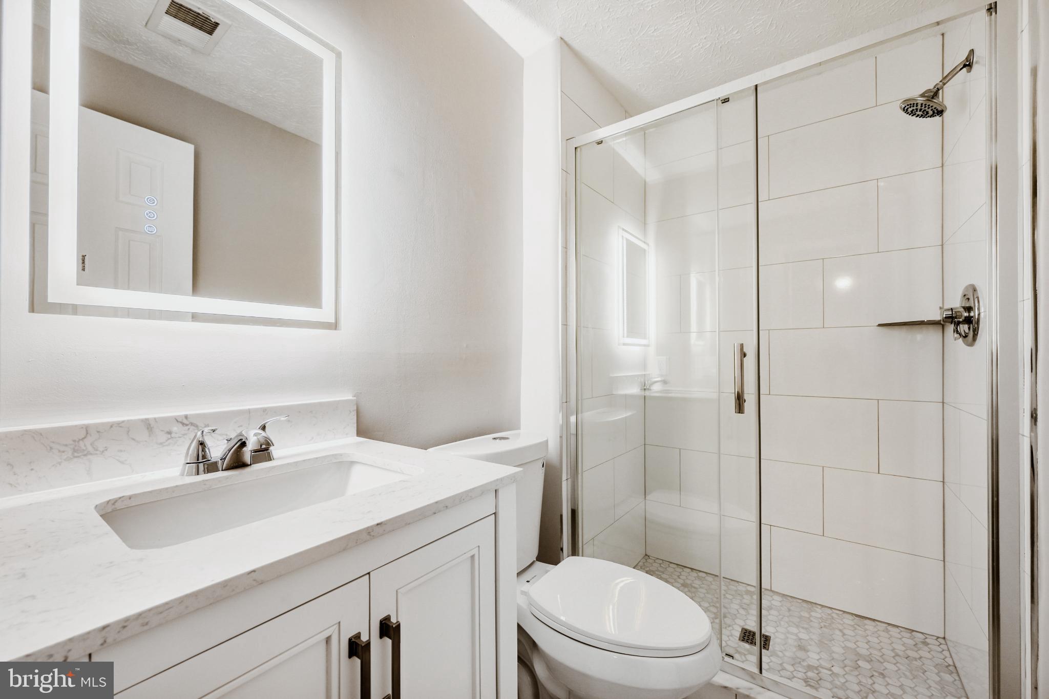 6351 Hanover Crossing Way Hanover, MD 21076 - Photo 28 of 34 Modern basement bathroom with sleek finishes.