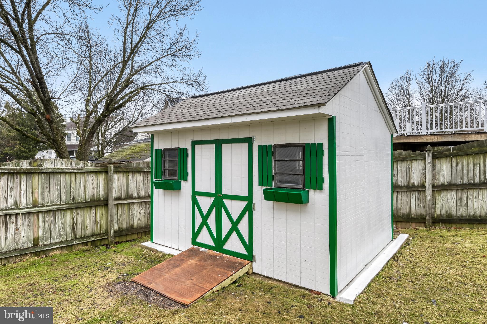 6351 Hanover Crossing Way Hanover, MD 21076 - Photo 31 of 34 Charming garden shed with vibrant accents.