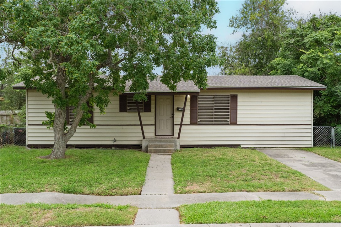 5921 Riley Drive Corpus Christi, TX 78412 - Photo 1 of 20 a front view of a house with a yard