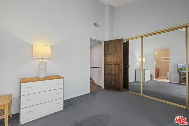 a bathroom with a sink vanity and a mirror