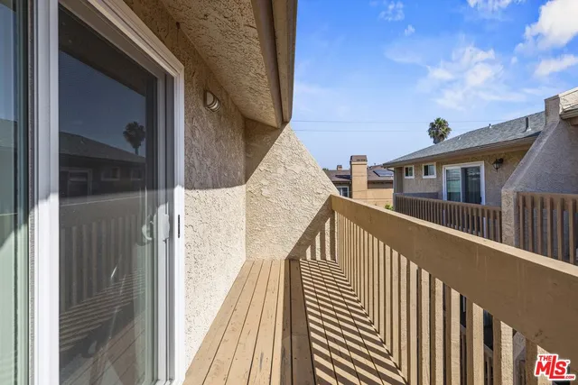 a view of balcony with wooden floor