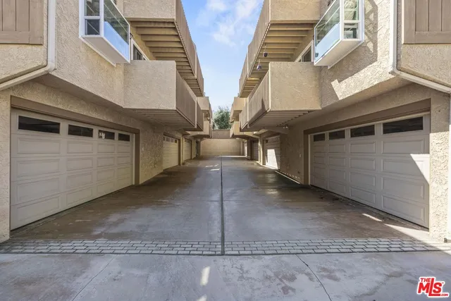 an aerial view of a house with outdoor space