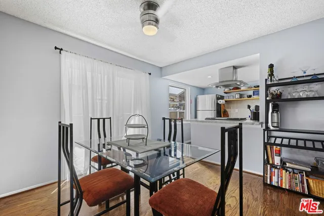 a workspace with furniture a book and wooden floor