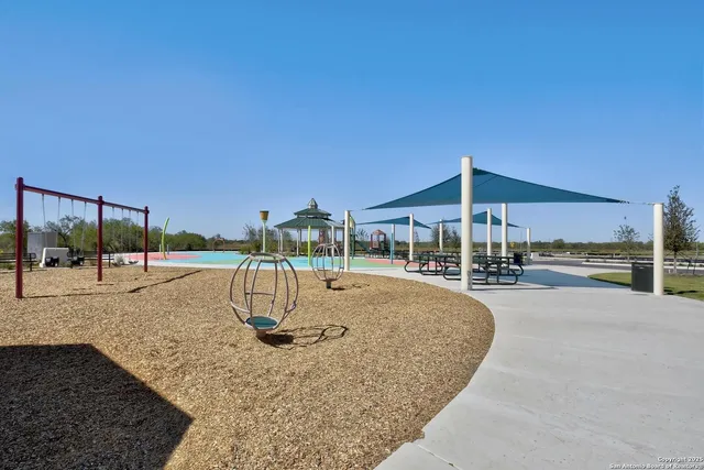 a view of a swimming pool with a patio