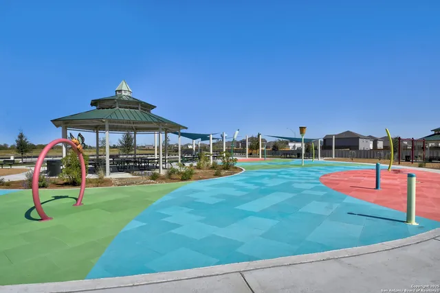 a view of a swimming pool with an outdoor seating