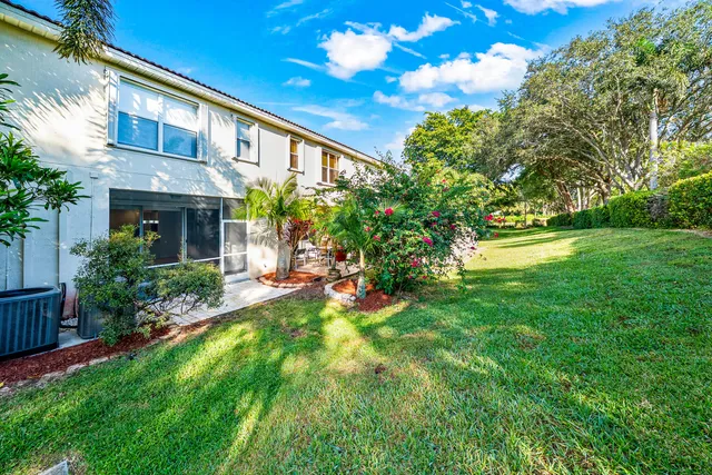 a house that has a tree in front of the house