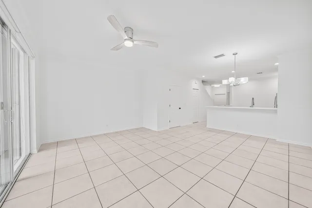 a view of an empty room and a window