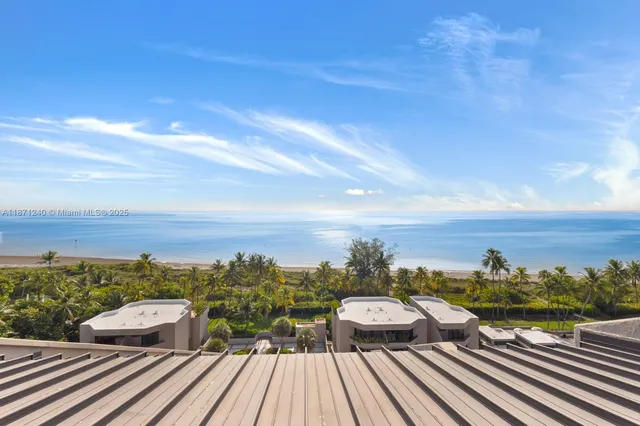a view of a balcony with wooden floor and city view