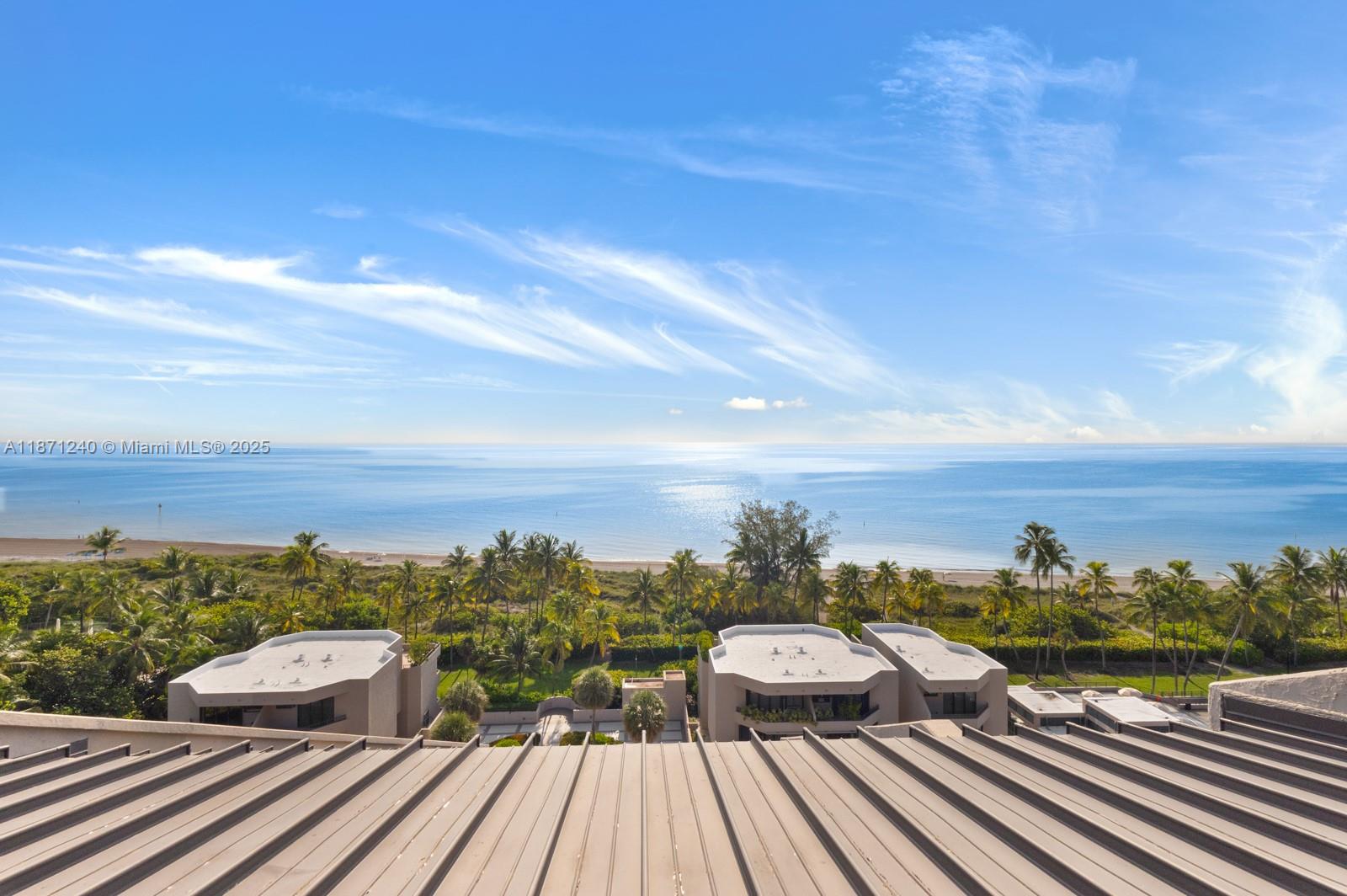 251 Crandon Boulevard, Unit 1036 Key Biscayne, FL 33149 - Photo 18 of 38 a view of a balcony with wooden floor and city view