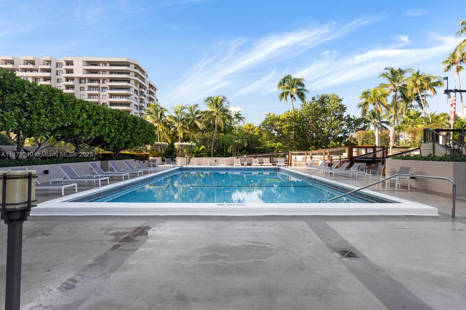 251 Crandon Boulevard, Unit 1036 Key Biscayne, FL 33149 - Photo 28 of 38 a view of swimming pool with a yard