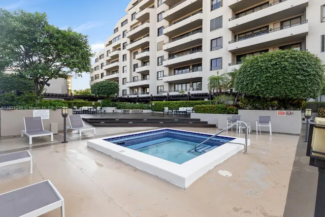 a view of a swimming pool with a lounge chair
