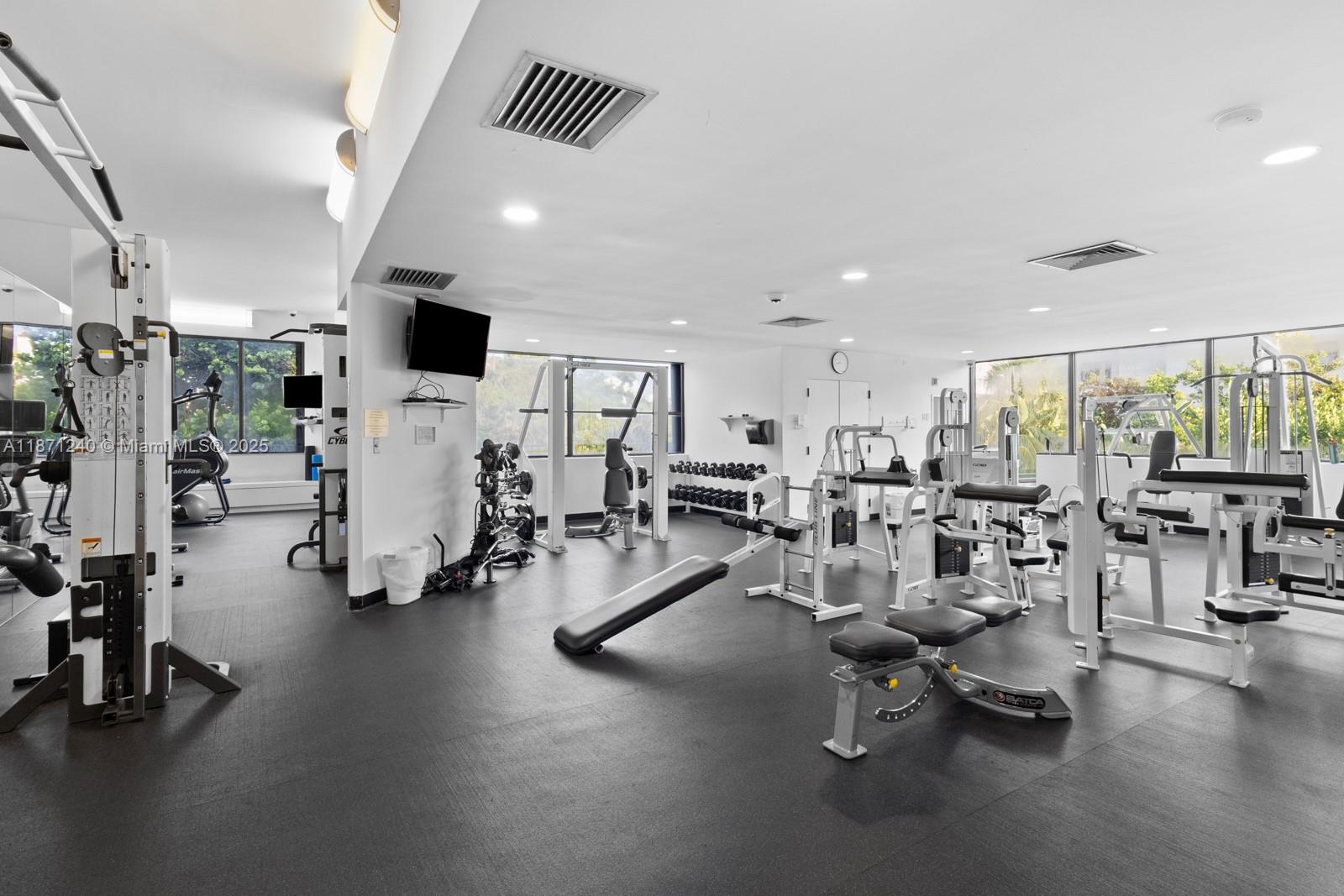 251 Crandon Boulevard, Unit 1036 Key Biscayne, FL 33149 - Photo 30 of 38 a view of a room with gym equipment