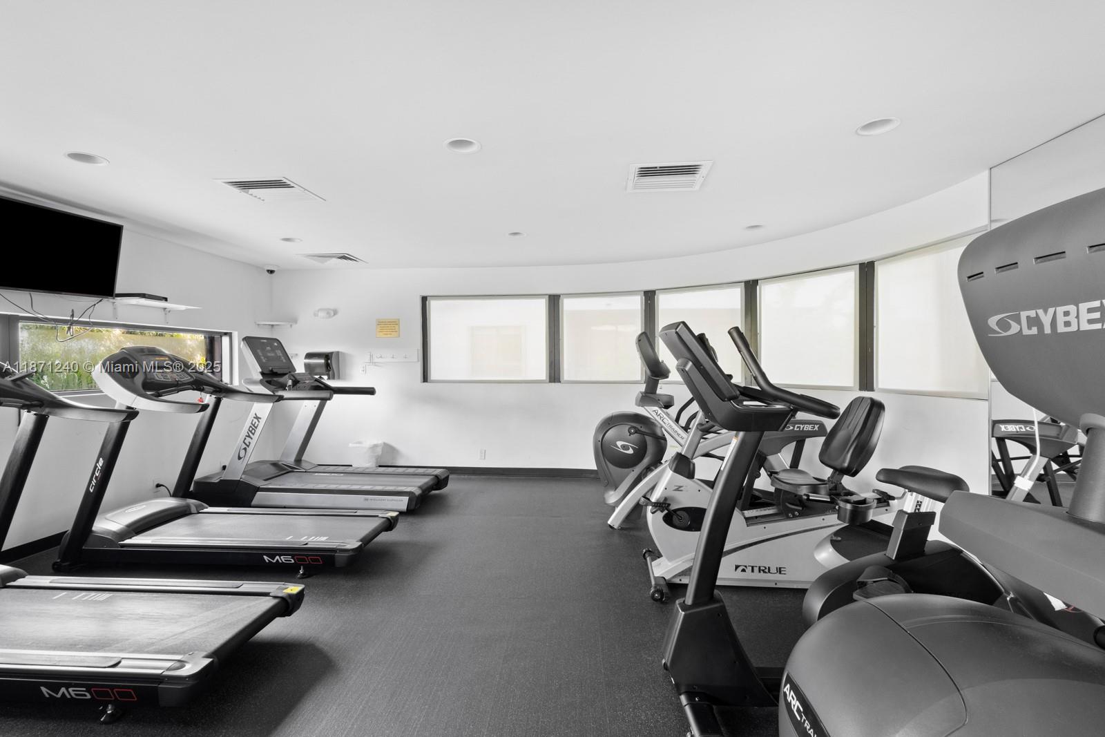 251 Crandon Boulevard, Unit 1036 Key Biscayne, FL 33149 - Photo 31 of 38 a view of a room with gym equipment