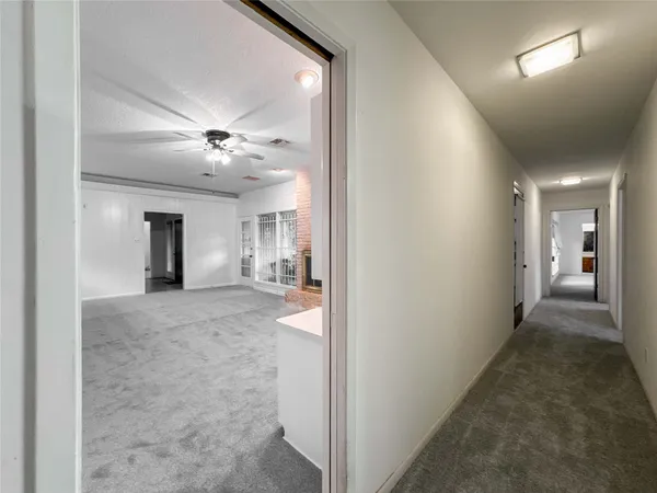 a view of hallway with chandelier