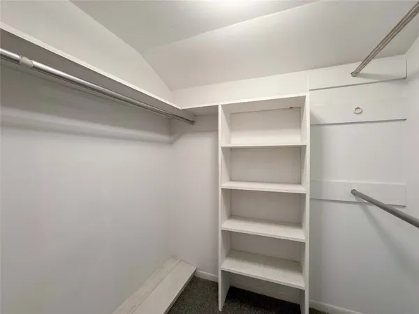a view of an empty walk in closet