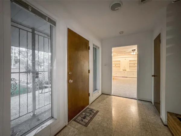 a view of livingroom with hallway and wooden floor