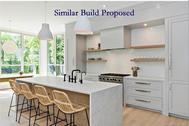 a kitchen with a stove a sink and cabinets