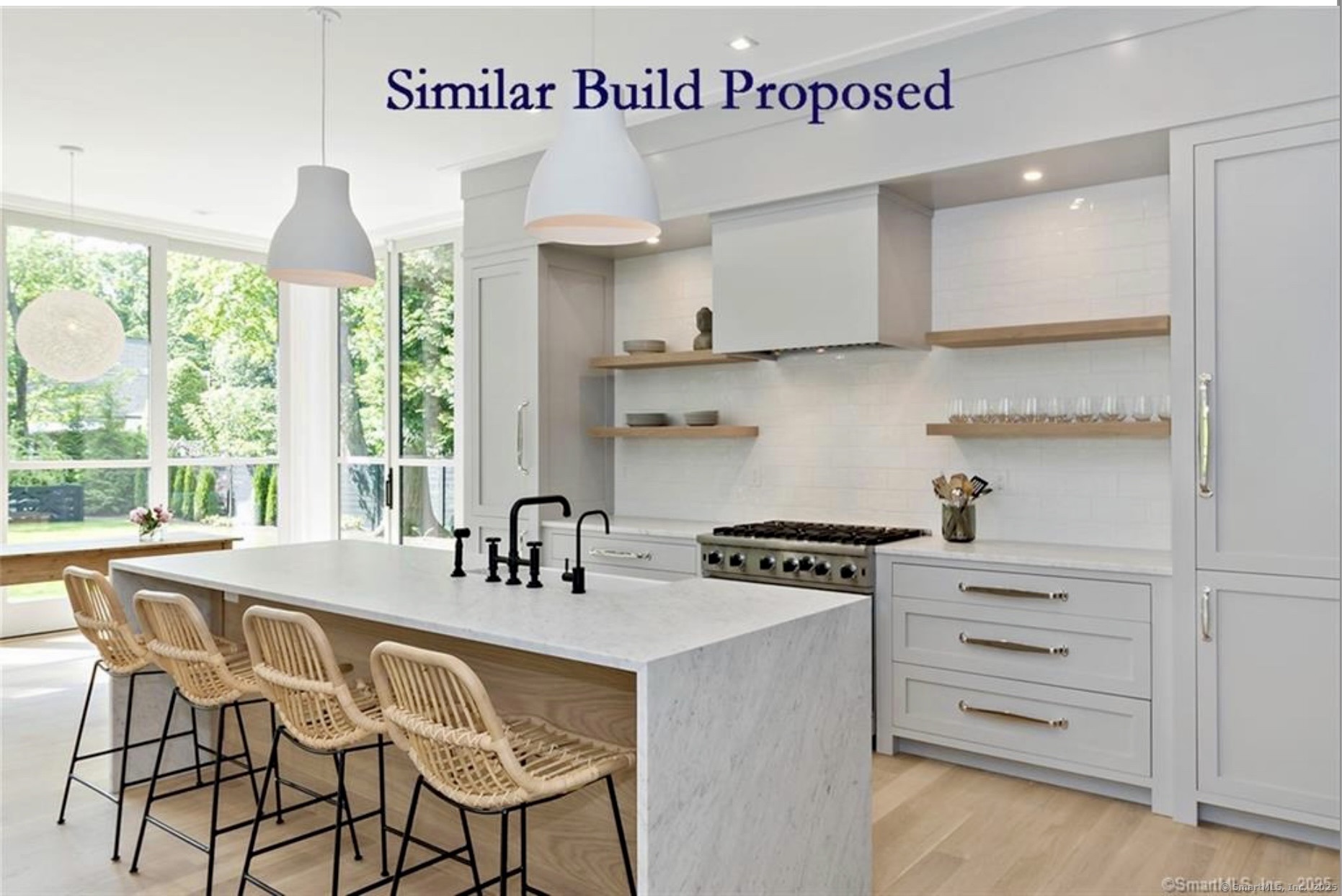 22 Brett Road Fairfield, CT 06824 - Photo 5 of 9 a kitchen with a stove a sink and cabinets