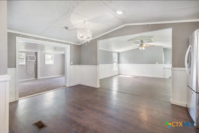 wooden floor in an empty room with a mirror