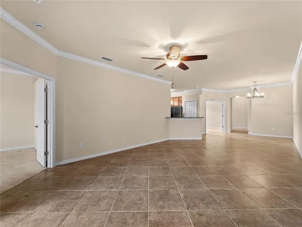 a view of a livingroom with a kitchen